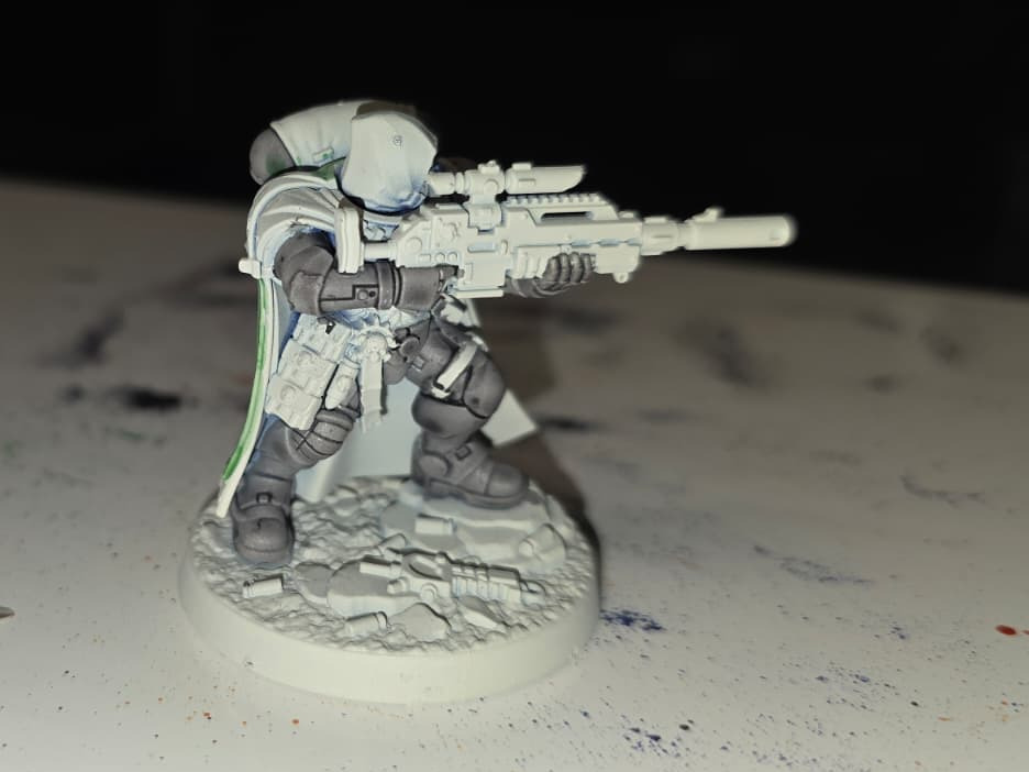 Image of a Warhammer Model in the middle of being painted